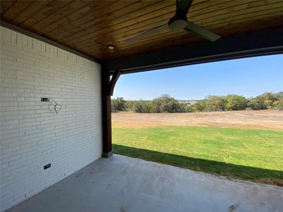 View of patio featuring ceiling fan and a rural view