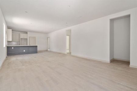 Unfurnished living room with light hardwood / wood-style flooring