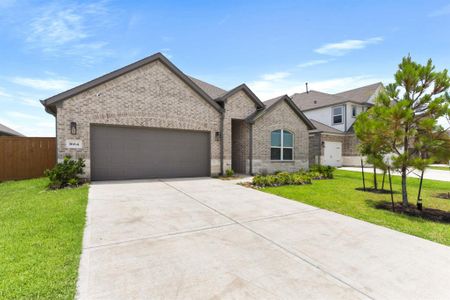 Welcome home to 1664 Daylight Lake Drive in the Sunterra Community in Katy!