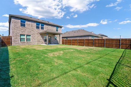 Back of property featuring a large yard. Great for entertaining