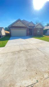 View of front facade featuring a garage