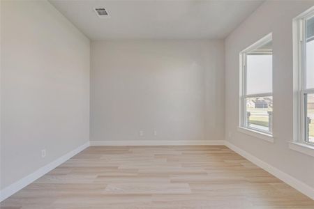 Spare room with light hardwood / wood-style floors