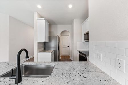 Kitchen with 42" cabinets and spacious pantry.