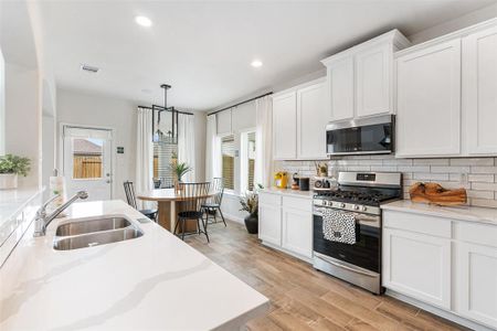 Quartz countertops, extended soft close cabinetry, luxury vinyl flooring; everything here plus more!