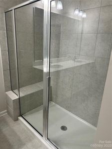 Super shower with seat in primary suite