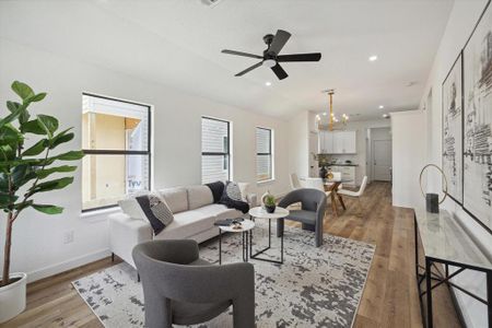 This amazing floorplan offers a fresh neutral color palette with luxurious vinyl plank flooring, neutral paint, chic lighting and fans, and scattered windows throughout allowing nearly every nook and corner to fill with soft natural light.
