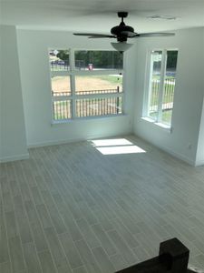 Spare room with ceiling fan and hardwood / wood-style floors