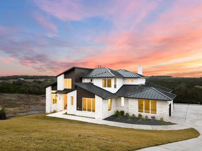 To the rear of the home is an old ranch and greenspace