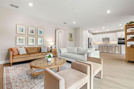 Large family room with extra recessed lighting.