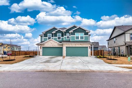 New construction Townhouse house 7101 Dancing Wind Ln, Del Valle, TX 78617 - photo 0