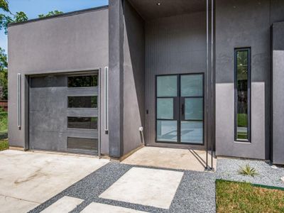 Doorway to property featuring a patio