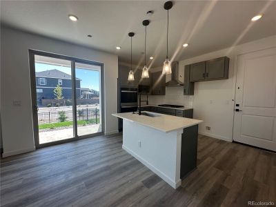 Kitchen with double ovens and built in cooktop