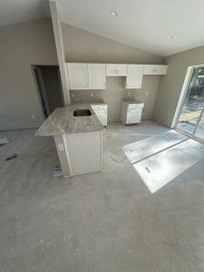 actual kitchen! still under construction, but showing the granite installed!