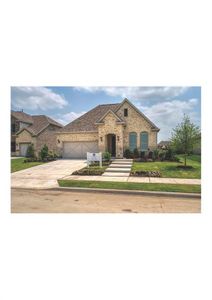 View of front facade featuring a garage