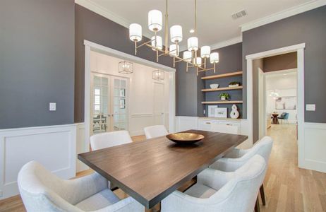 Another view of the dining room. note the floating shelves and entry way to the butler's pantry.