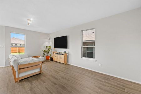 Living room with hardwood / wood-style flooring