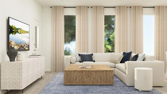 Living room with light wood-type flooring and plenty of natural light