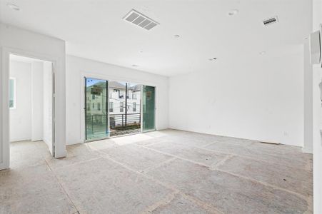 Spacious living area with sliding glass doors