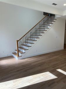 Stairway with hardwood / wood-style floors