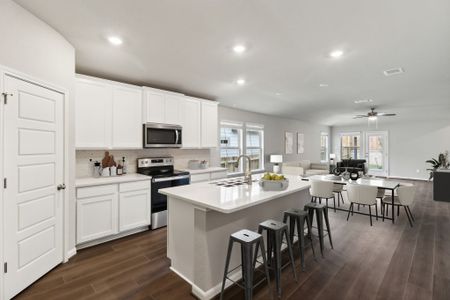 Virtually staged kitchen in the Callaghan floorplan at a Meritage Homes community.