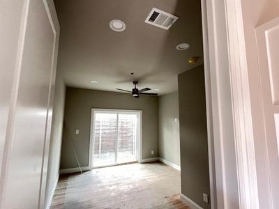 Spare room featuring light hardwood / wood-style floors and ceiling fan