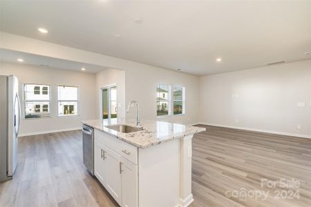 Open concept kitchen, living room and dining area