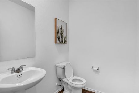 Spacious downstairs half bath located next to the office/flex room.