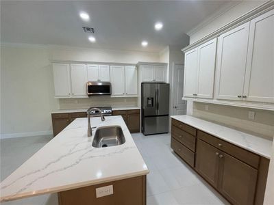 Island kitchen with quartz tops