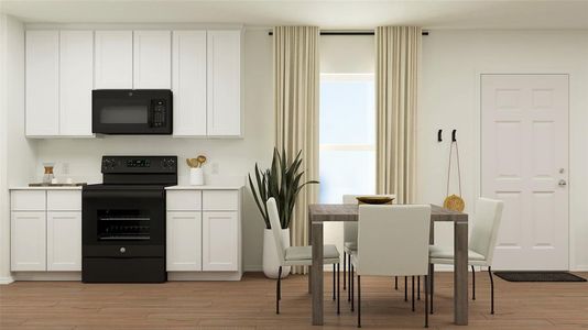 Kitchen with black appliances, light wood-type flooring, and white cabinets