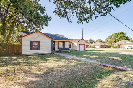 Ranch-style home with a front lawn