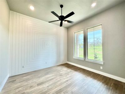 Offfice space featuring ceiling fan and light hardwood / wood-style floors