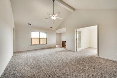 Living room featuring beam ceiling, high vaulted ceiling, carpet flooring, and ceiling fan