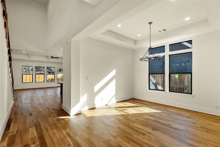 As you enter the front foyer, the private study as well as the full formal dining room both light filled. Modern fixtures thruout the home as well as FULL white Oak Hardwoods