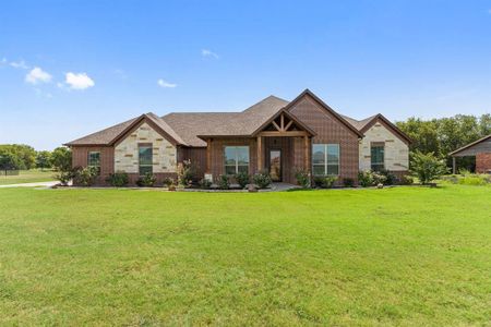 Craftsman-style house with a front yard