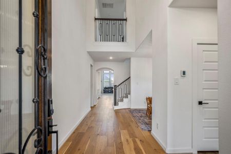 Walking in, you find a bright entryway with high ceilings, bright natural light, and beautiful light wood flooring that continues into the main living areas making it easy to clean and maintain.