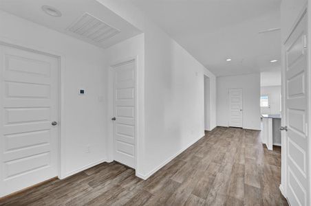 Walking into the Main Living notice the Beautiful Carefree Vinyl Looking Floors leading the way! **Image representative of plan only and may vary as built**