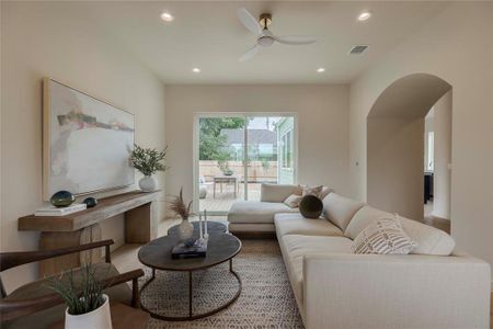 Beautiful light filled living room just off the entry and steps from the kitchen