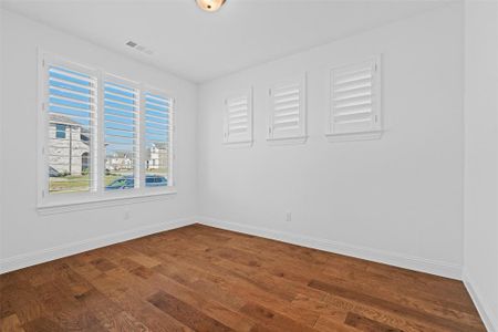 Unfurnished room with wood-type flooring