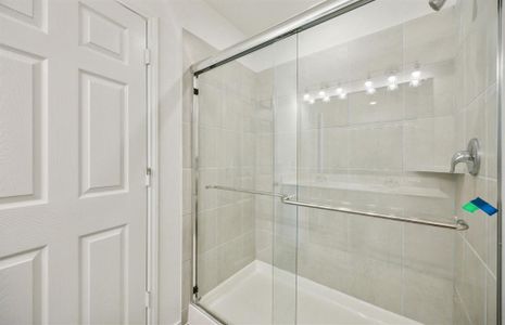 Owner's bath with oversized shower *real home pictured