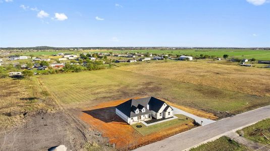 Birds eye view of property with a rural view