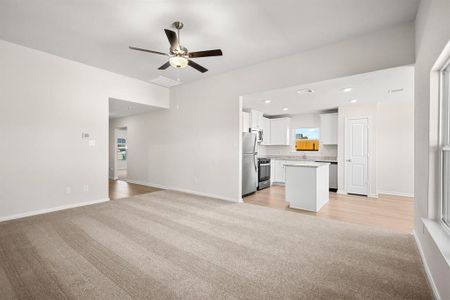 The Living room is spacious and is open towards the kitchen.