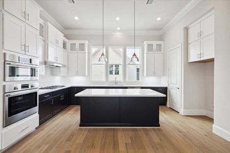 Tuxedo Kitchen dressed up with Stacked Cabinets, Bosch Appliances, Quartz Counters