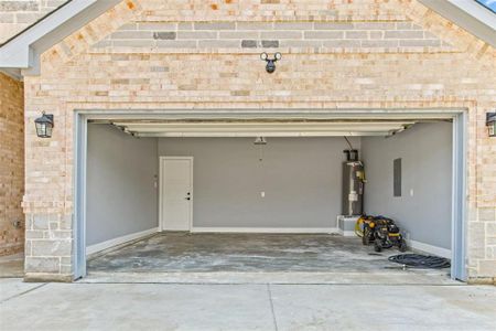 Garage with electric panel and water heater