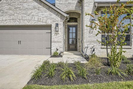 Property entrance with a garage