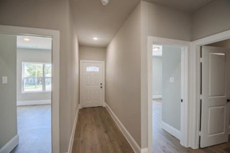 Hallway featuring wood-type flooring
