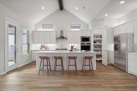 Kitchen in the Matisse home plan by Trophy Signature Homes – REPRESENTATIVE PHOTO