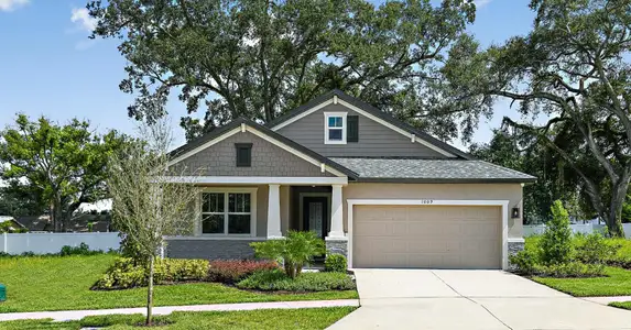 Sweetwater craftsman elevation with optional stone new construction home plan by William Ryan Homes Tampa