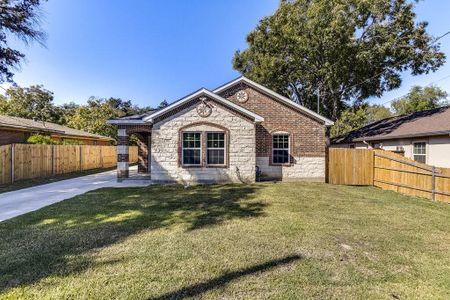 Rear view of house featuring a yard