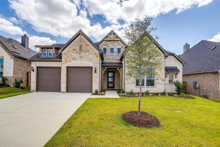 View of front facade with a garage and a front yard