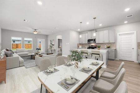 This light and bright spacious living room, with eat in kitchen, is more like a great room and the perfect layout for entertaining or just relaxing. Featuring an extra large Quartz kitchen island, Grey cabinetry, EVP flooring, recessed lighting and additional pendant lighting.